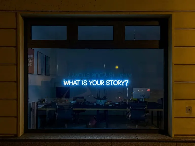 'What is Your Story' window sign
