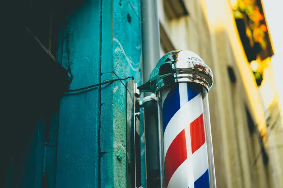 Traditional barber shop exterior on a quiet British high street